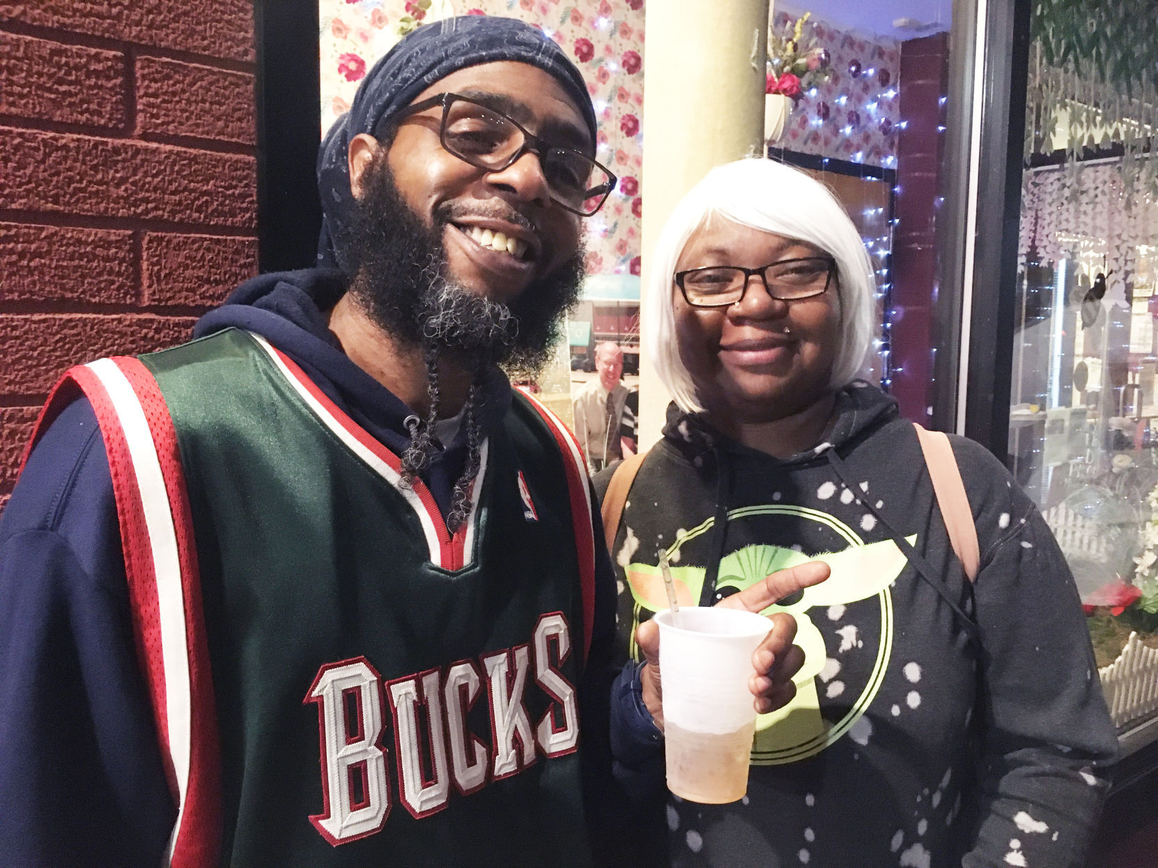 Sam Jones and Allen Jones relax during Bucks championship watch party in Racine